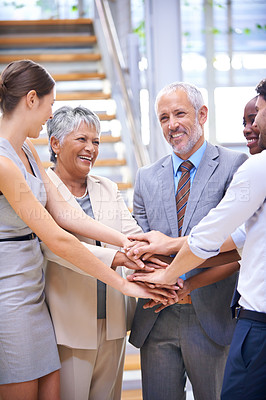 Buy stock photo Businesspeople, stacked hands and teamwork for happy office employees with smile. Corporate professional, coworkers in workspace for cooperation with partnership, people in law firm career or support