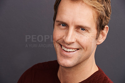 Buy stock photo Happy, portrait and man with beauty in studio, dark background and smile with pride or confidence. Healthy, skincare and face of person with wellness from dermatology or model relax in mockup