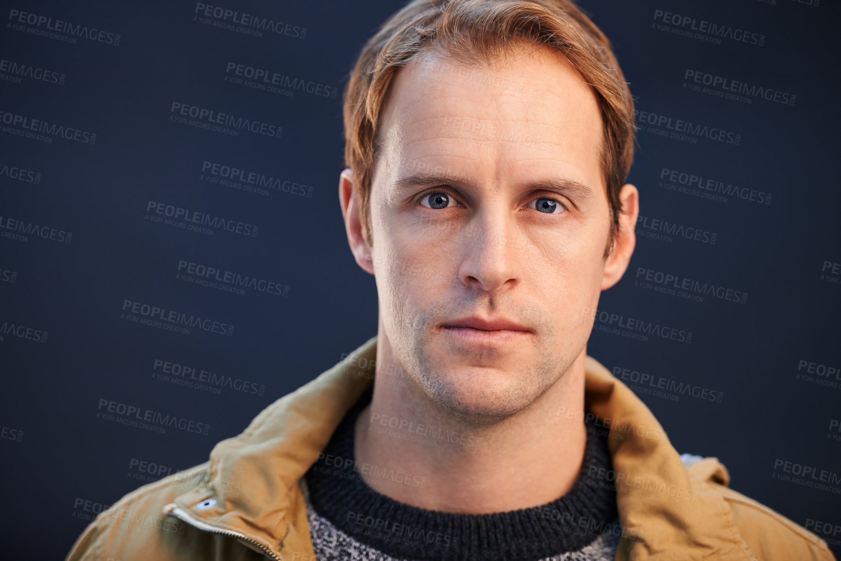 Buy stock photo A cropped studio shot of a handsome man looking serious