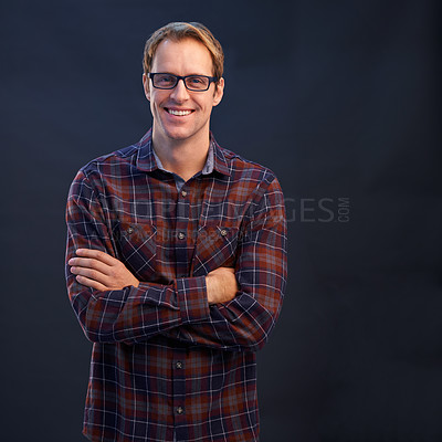 Buy stock photo Happy, man and portrait of nerd in studio with arms crossed and pride on dark background. Confident, programmer and person with a smile in development of solution for IT project in mockup space