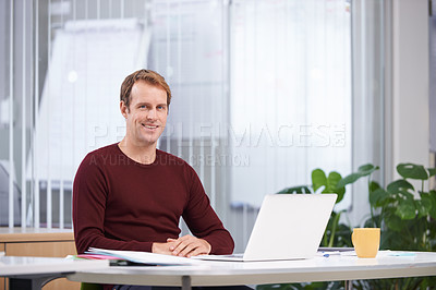 Buy stock photo Portrait, smile and business man on laptop at desk in office for creative career in startup company. Face, employee or happy professional on computer at table, copywriter or entrepreneur in Australia