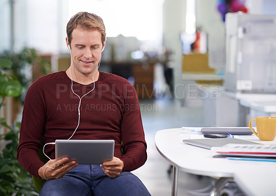 Buy stock photo Tablet, relax and businessman with earphones, desk and working in office workplace. Smile, technology and watching business videos or streaming, elearning and internet research for online project