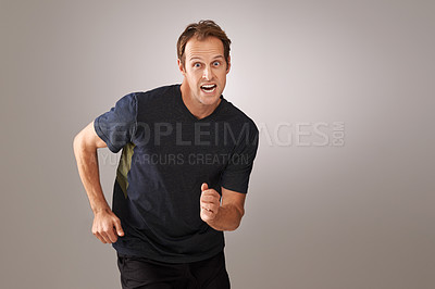 Buy stock photo Man, portrait and fitness in studio with running for exercise, marathon and workout with confidence. Athlete, person and cardio for healthy body, wellness and training with mockup on white background