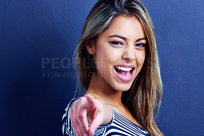 Buy stock photo Studio, portrait and woman pointing with finger, excited and happiness on face of female person. Blue background, hands and deal for fashion, aesthetic and smile for clothes, girl with choice