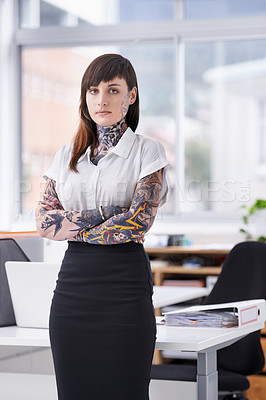 Buy stock photo Tattoos, crossed arms and portrait of business woman in office with serious, pride and confident attitude. Grunge, professional and edgy creative designer with ink skin standing in modern workplace.