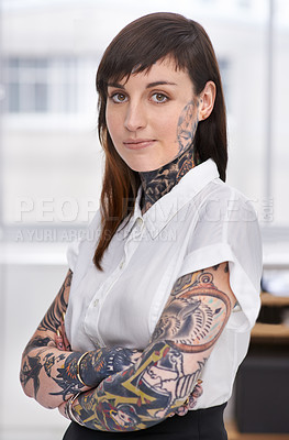 Buy stock photo A tattoo-covered young businesswoman in her office