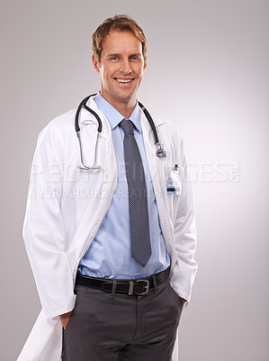 Buy stock photo Cropped studio shot of a relaxed young doctor