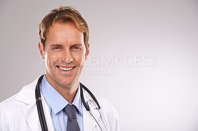 Buy stock photo Man, doctor and smile in studio, portrait and medical professional on gray background. Male person, healthcare and pride for cardiologist career, physician and trustworthy specialist for medicare