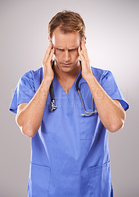 Buy stock photo Doctor, studio and headache for stress, burnout or tension and stethoscope. Man, worry or migraine for professional, medic and health care or medical pressure and overworked on white background