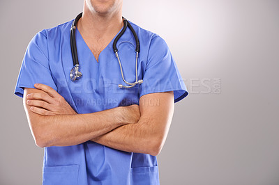 Buy stock photo Man, nurse and arms crossed for healthcare in studio, confidence and physician on gray background. Male person, medical expert and pride for medicare, professional and support or help for diagnosis