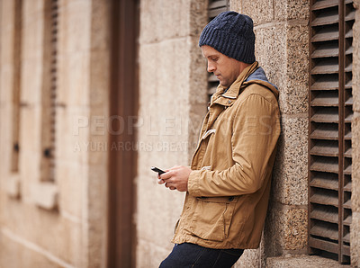 Buy stock photo Relax, typing and man in city with phone for social media, networking and online text message in street. Travel, weekend and person on cellphone for website, internet search and chat in urban town