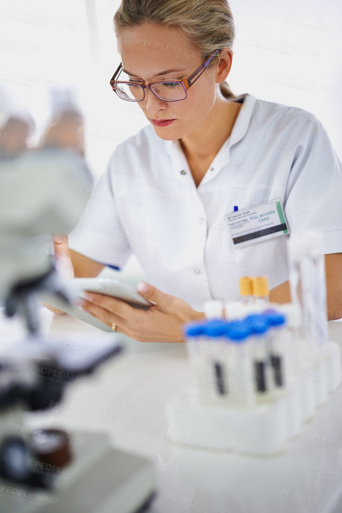 Buy stock photo Medical, research and woman reading with tablet in laboratory with development in biotechnology. Doctor, typing or check results online of pharmaceutical report or review of innovation in science