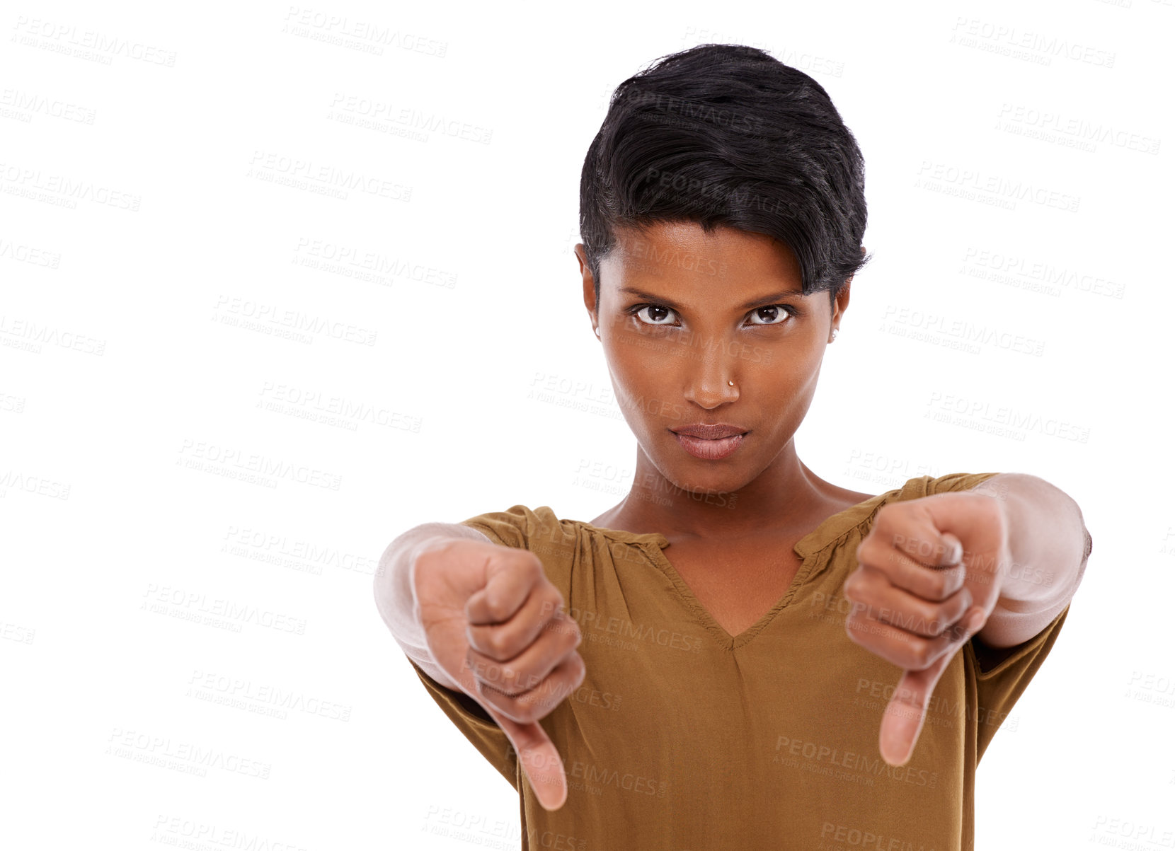 Buy stock photo Studio shot of a young woman giving thumbs down