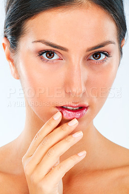 Buy stock photo Woman, face and hand on lips for beauty, dermatology and wellness with shine isolated on white background. Skincare, portrait and balm on mouth for cosmetic care, manicure and healthy skin in studio