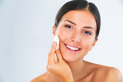 Buy stock photo Skincare, portrait and woman with a cotton pad in studio for a beauty, natural and face routine. Health, wellness and happy female model with health, wellness and cosmetic product by gray background.