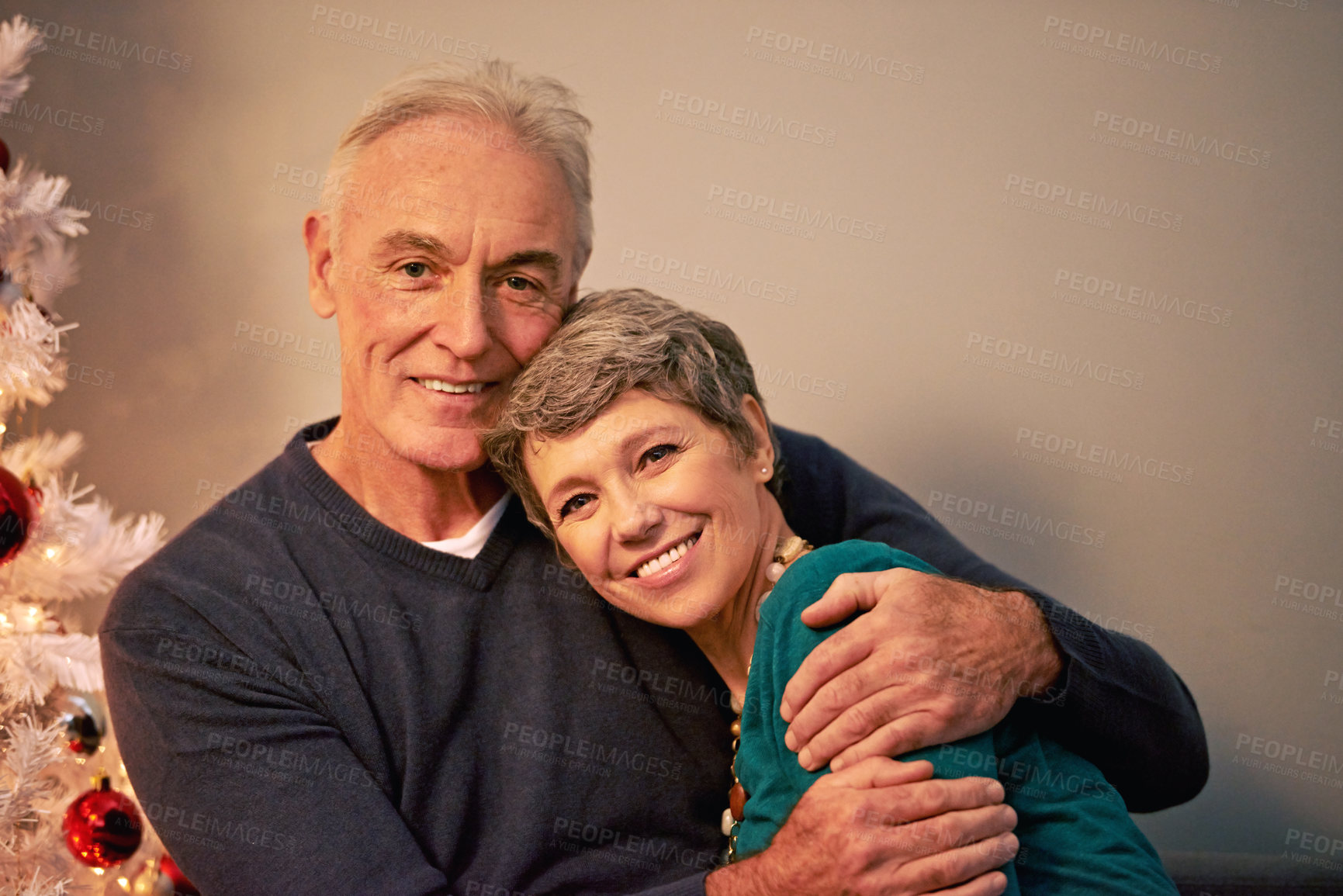 Buy stock photo Christmas, portrait and senior couple hug with love, care and support together in a home on holiday. Tree, retirement and marriage with smile and happy in house with celebration and romance with joy