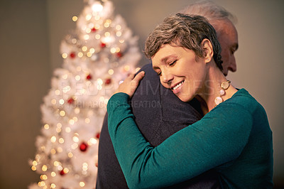 Buy stock photo Cropped shot of a happy couple embracing at Christmas