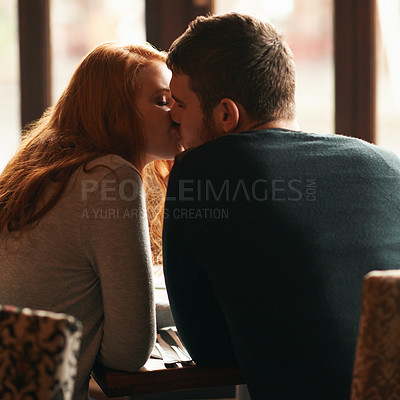 Buy stock photo Couple, love and kiss on date at cafe for bonding, romance or healthy relationship with rear view. Man, woman and affection at restaurant with caring, trust and fine dining on anniversary vacation