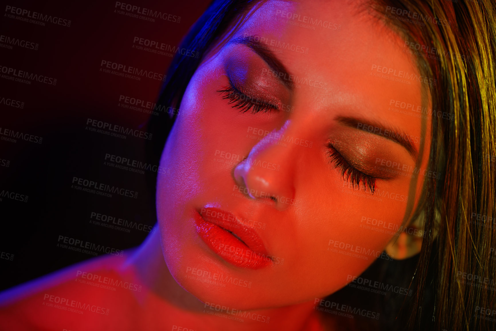 Buy stock photo Studio shot of a beautiful young woman with artistic lighting