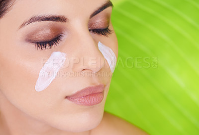 Buy stock photo Cream, closeup of woman and beauty with palm leaf background, moisturizer and natural skincare for dermatology. Organic, nature and eco cosmetics with lotion, eyeshadow with sustainable facial