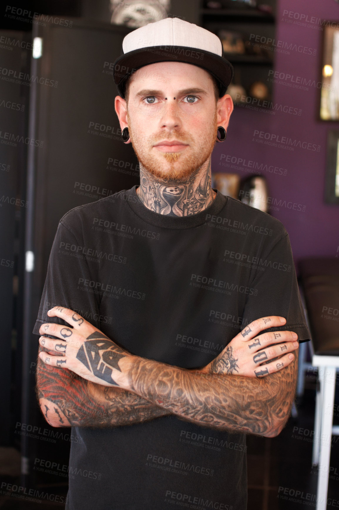 Buy stock photo Punk, tattoos and portrait of a male artist standing with crossed arms for confidence in his studio. Serious, cool and face of grunge man with edgy, funky and body art or ink creative business store.