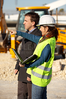 Buy stock photo A architect talking to her contractor