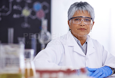Buy stock photo A senior female scientist working in her lab