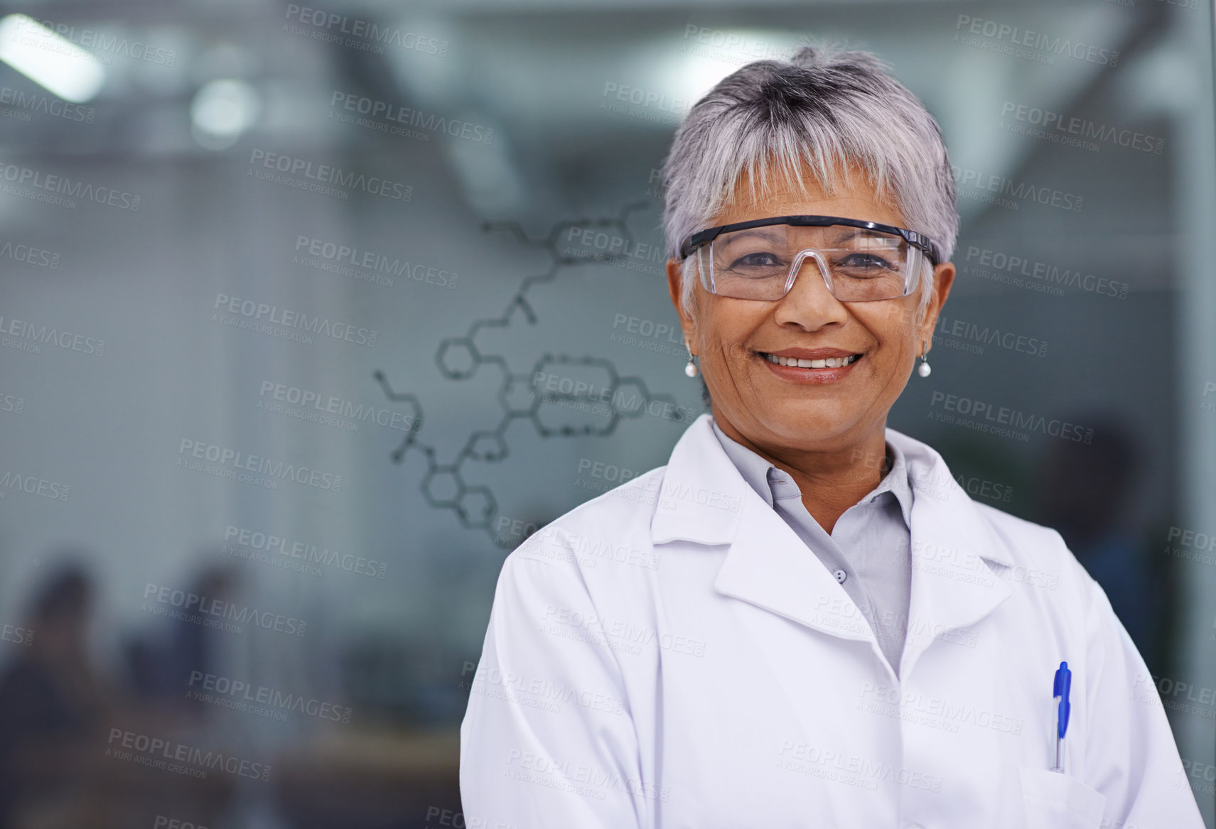 Buy stock photo A female scientist standing before a glass board with a formula on it