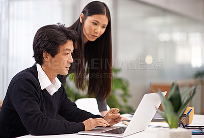 Buy stock photo Mentor, help and laptop in office with teamwork or businessman learning from support of woman. Feedback, advice and manager training asian man on computer in collaboration and reading online research