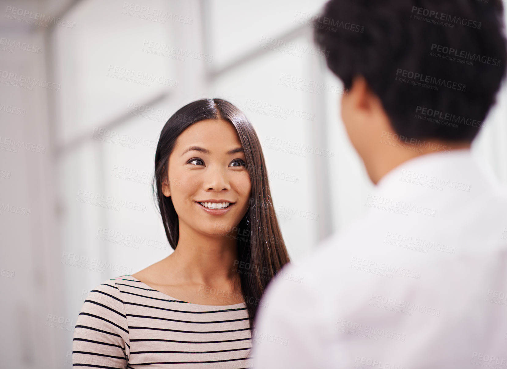 Buy stock photo Business, cooperation and happy woman in conversation at office with feedback on project collaboration. Japanese, employee and talk to businessman with creative ideas, development or social teamwork