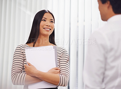 Buy stock photo Documents, meeting and Asian business people in discussion, conversation and talking in office. Professional, creative agency and man and woman with project for planning, collaboration and teamwork