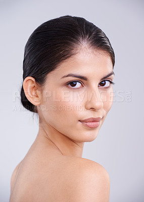 Buy stock photo Cropped studio shot of a beautiful brunette woman against a gray background