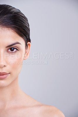 Buy stock photo Woman, portrait and face with skincare, cosmetics or facial treatment on a gray studio background. Young female person, brunette or model in satisfaction for beauty, makeup or cosmetology on mockup