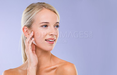Buy stock photo Woman, skincare and wellness in studio with space, results or hand on face with natural glow by purple background. Girl, person and model with cosmetics, mock up and facial transformation for beauty