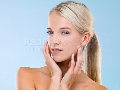 Buy stock photo Health, portrait and woman with skincare cosmetics in studio with beauty, wellness and face routine. Glow, natural and female person with dermatology facial treatment isolated by blue background.