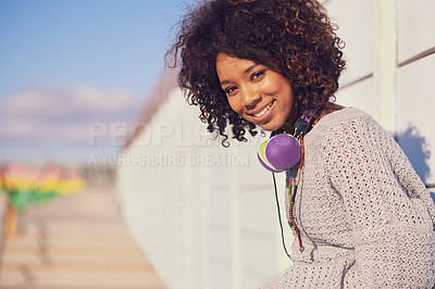 Buy stock photo Woman, smile and portrait in city for travel, walk and break in urban for summer, fun and outdoor. African person and happy with headphones for music, streetwear and  journey in town for trip 