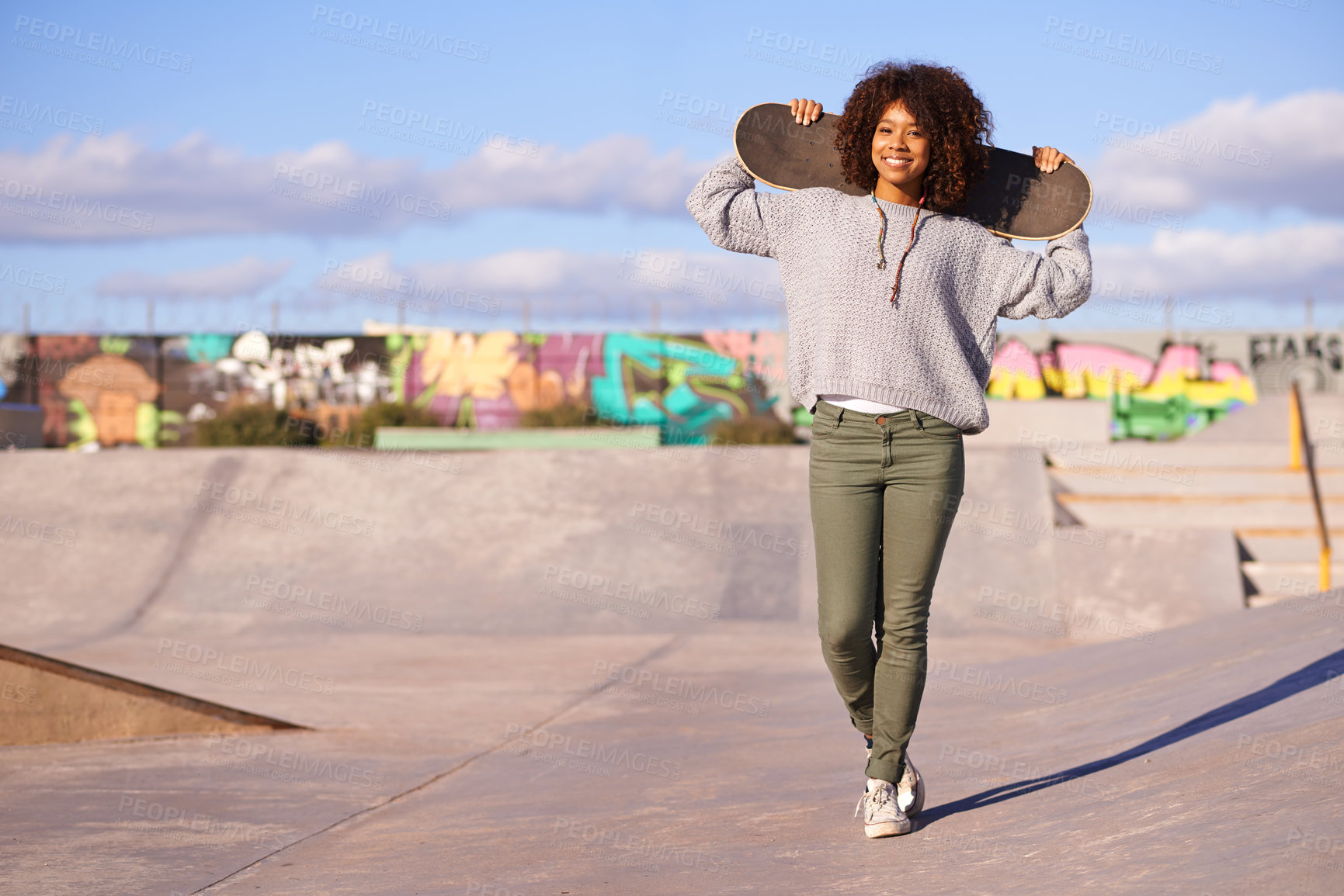 Buy stock photo Skatepark, woman and summer for skate, recreation and fun outdoor for active and game for break or holiday. African person and happy for performing, trick and sports for wheel and action on mockup
