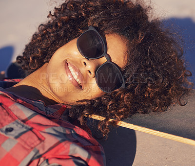 Buy stock photo Black woman, outdoor and smile with sunglasses on skateboard for training and relax in Atlanta . Closeup, female person and skater with hobby or sport for fitness, health and fun at skatepark