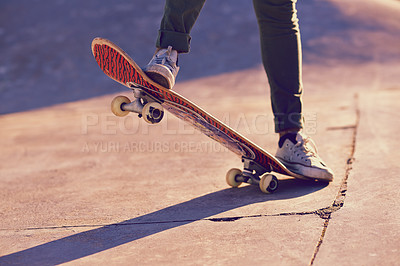 Buy stock photo Skateboard, sneaker and person in skatepark for skate, recreation and active for game with wheels. Speed, move and performing for trick, sports and action on ground for toy and balance in summer

