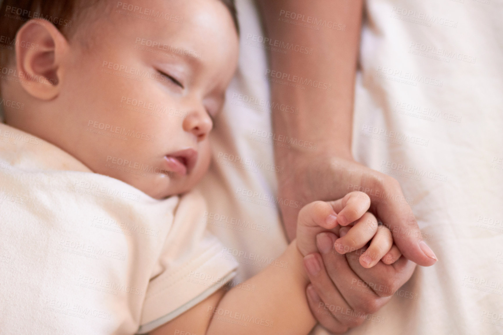 Buy stock photo Baby, sleeping and mother holding hands in a home bedroom with parent support, care and love. Relax, bed and young girl with mom in a house tired and sleepy with kid and mama together feeling calm