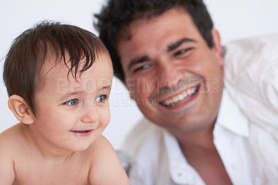 Buy stock photo Happy man, baby and together with smile for development, growth and health in wellness. Father, son and excited with hope with future in family home, quality time and bonding with love in Germany