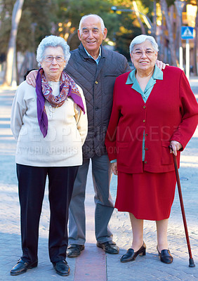 Buy stock photo Portrait of three elderly people standing outdoors