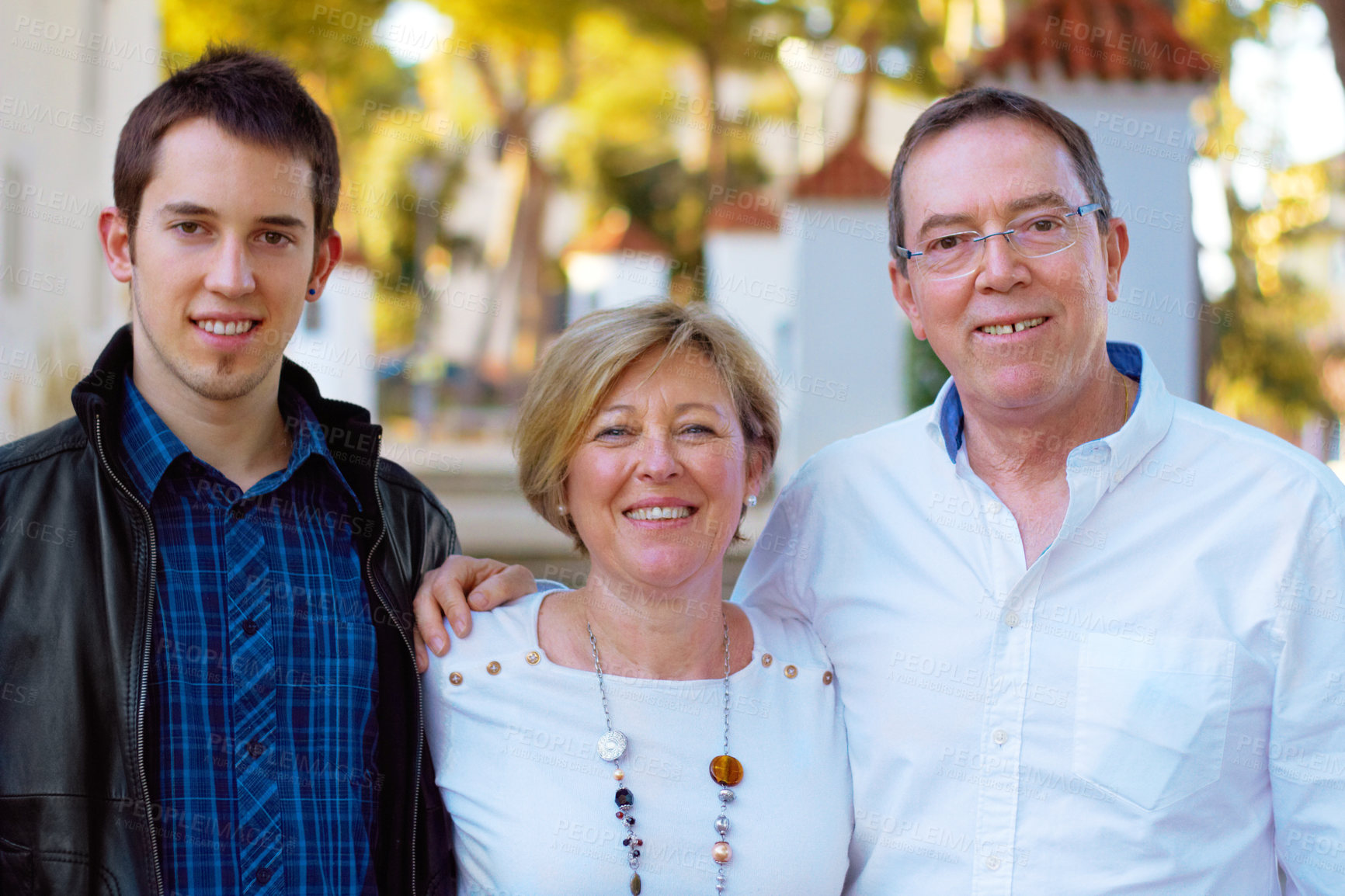 Buy stock photo Portrait of a couple and their son standing outdoors