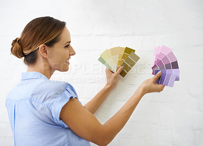 Buy stock photo Color sample, wall and woman in house for interior design or renovation project and swatches for paint decision or options. Person, remodeling and diy for home improvement or creativity and upgrade