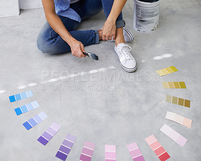 Buy stock photo Feet, paint swatch and color for renovation in home, remodeling and maintenance in apartment. Person, floor and choice or decision for interior upgrade, diy and brush for house repairs or project