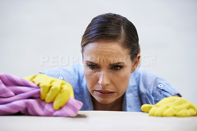 Buy stock photo Woman, gloves and cleaning table in home, disinfection and remove dirt or bacteria for maintenance. Female person, housekeeeping and wash with detergent or sanitation, maid and chemical for germs