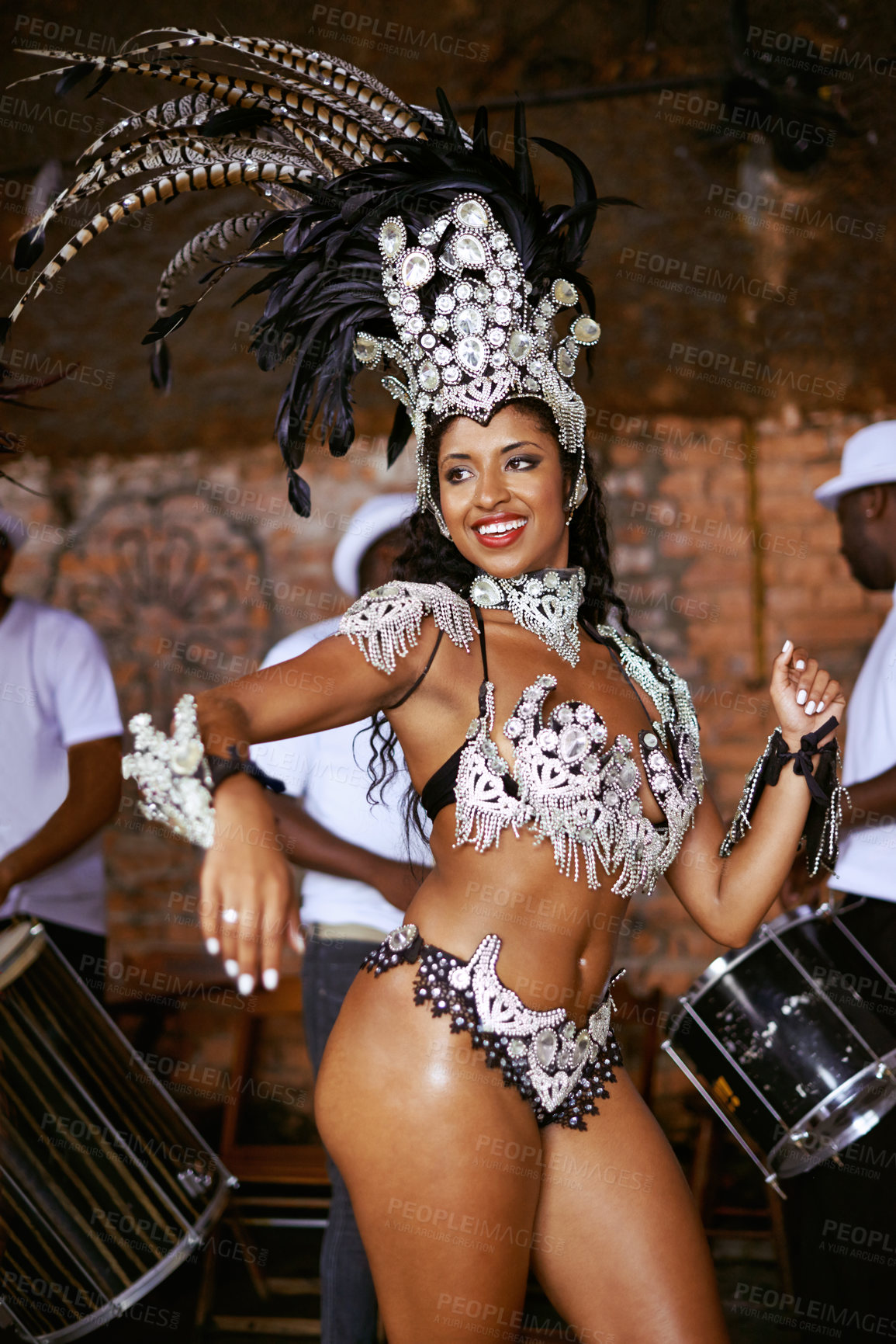 Buy stock photo Shot of a beautiful samba dancer performing in a carnival with her band