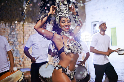 Buy stock photo Shot of an attractive female Mardi Gras dancer in an elaborate beaded costume and feather headdress