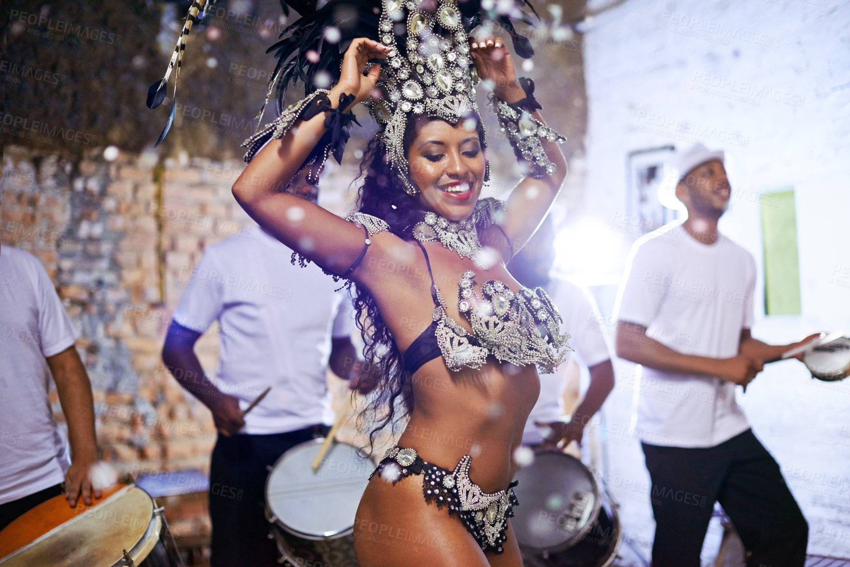 Buy stock photo Shot of an attractive female Mardi Gras dancer in an elaborate beaded costume and feather headdress