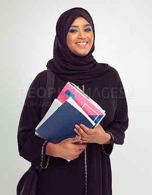 Buy stock photo Portrait, muslim and books with a student woman in studio on a gray background for learning or education. Islam, university and study with an islamic female at college to study on a scholarship